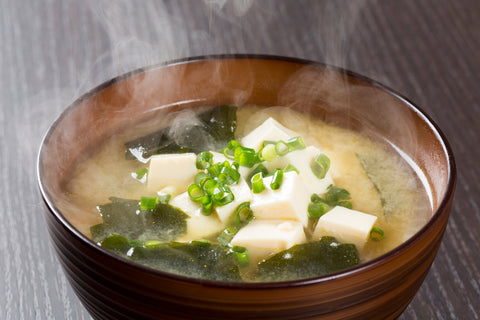 Japanese steamed miso soup with steam rising(tofu&seaweed) for the first meal of the day. With green onions