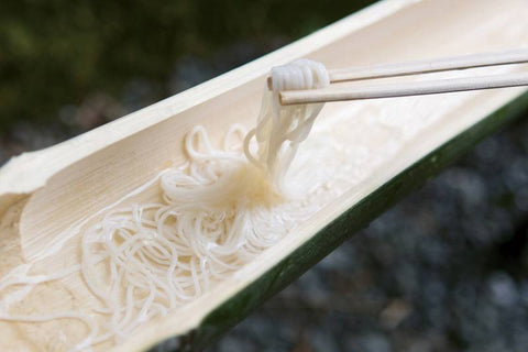 white noodles in flowing water