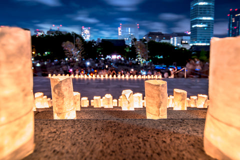 Handmade japanese washi paper lanterns illuminating the stone steps of the Zojoji temple near the Tokyo Tower during Tanabata Day on July 7th.