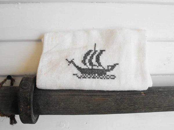 cross-stitch sail boat on linen hand towel
