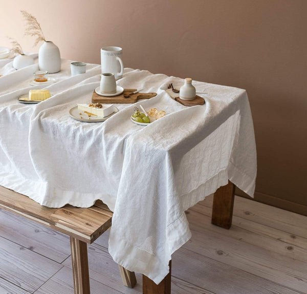 white cloth tablecloths