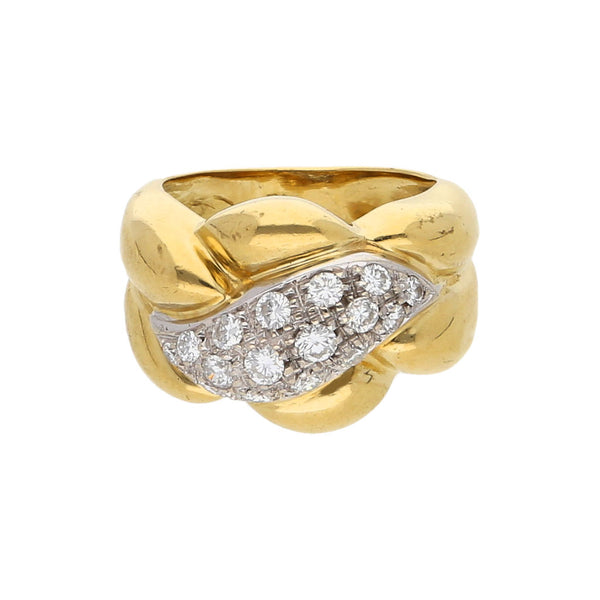 Anillo estilizado firma Louis Vuitton con diamantes en oro dos tonos 18  kilates.