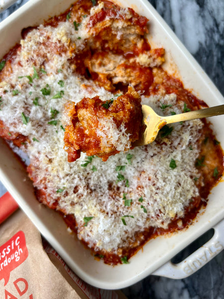 chicken parmesan meatballs in baking dish