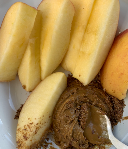 Sliced apple with sunflower butter