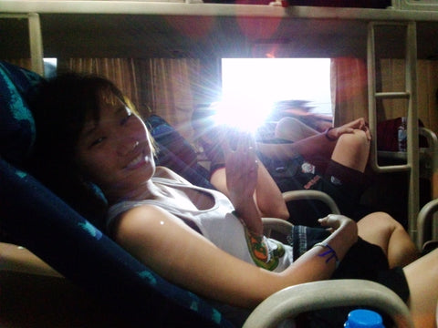 On an overnight sleeper bus, commuting between cities in Vietnam.