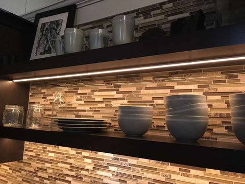 Floating wood shelf with LED lights underneath