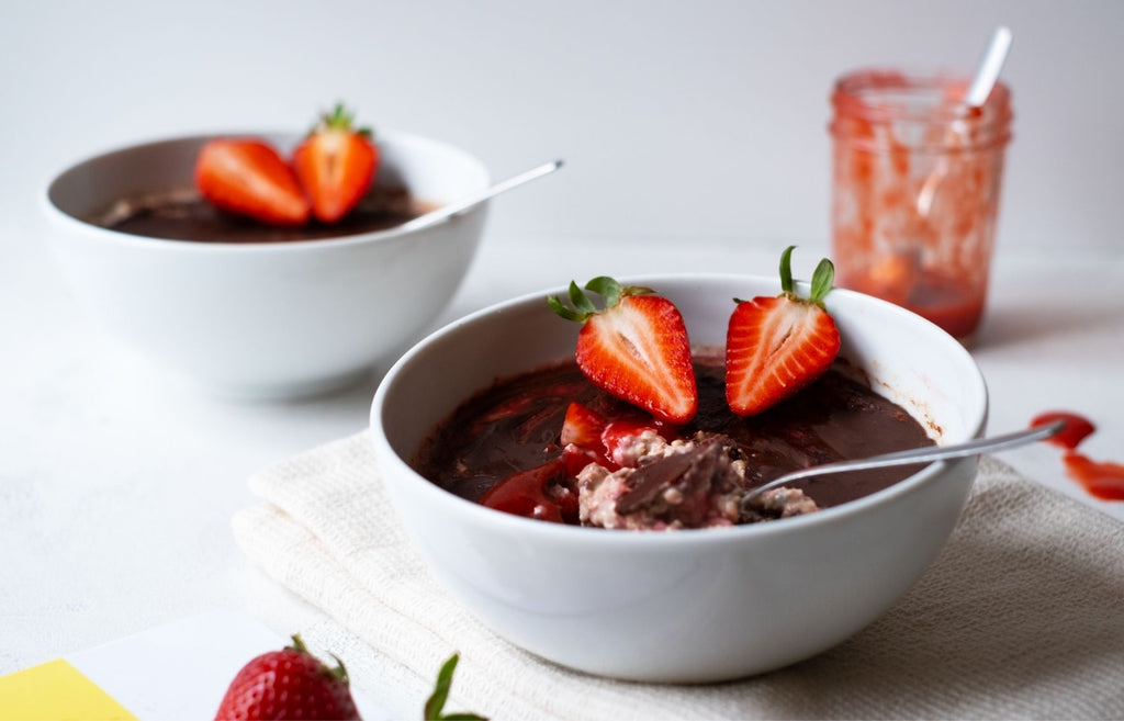 Noble strawberry overnight oats with a liquid strawberry core and a crunchy chocolate layer