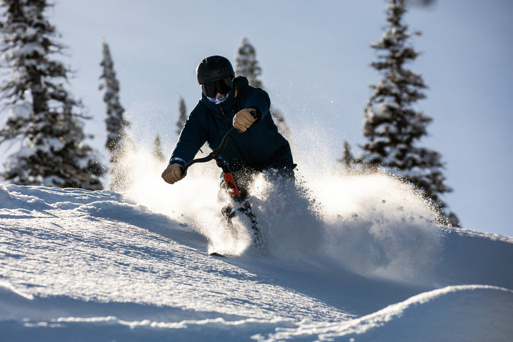 Ski Biking on a Snowgo bike in deep powder