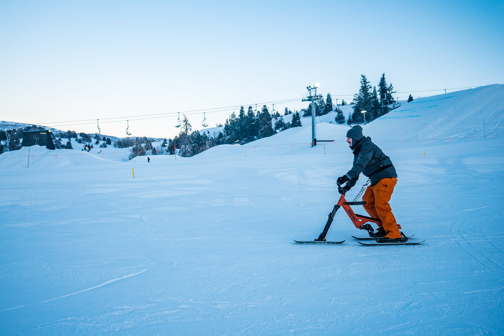 ski bike descends the slopes at a ride center