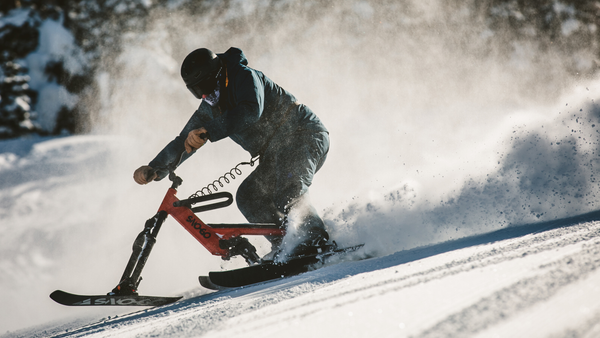 sno-go ski biker rides the new shift snow go down the mountain