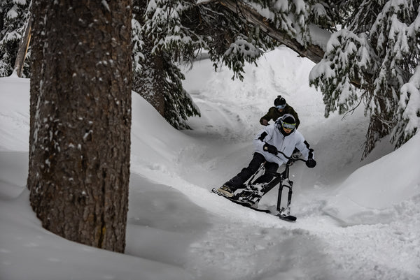 SNO-GO Ski Bikers Ride Through Berms