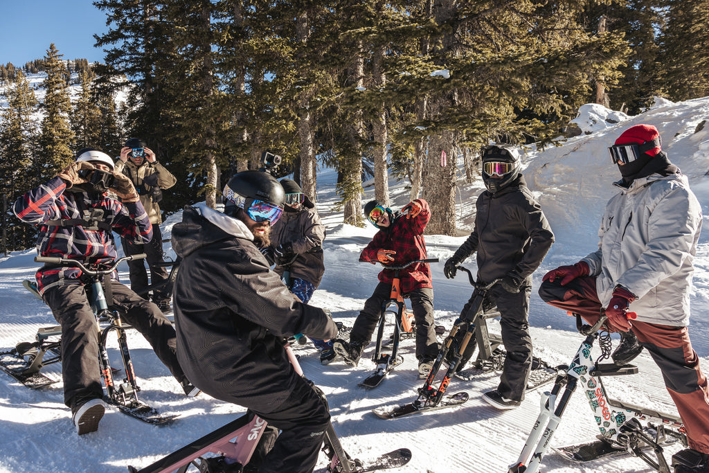 SNO-GO Fest riders take a breather after a heater tree run.