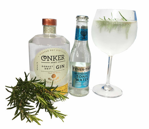 Conker Spirit Gin with Fever Tree Mediterranean Tonic Water, a balloon glass with gin and tonic and a sprig of rosemary 