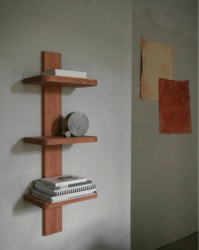 atelier shelf on wall with objects and books