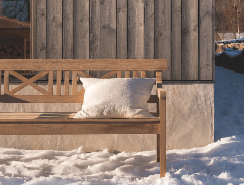 barriere pillow on bench outside