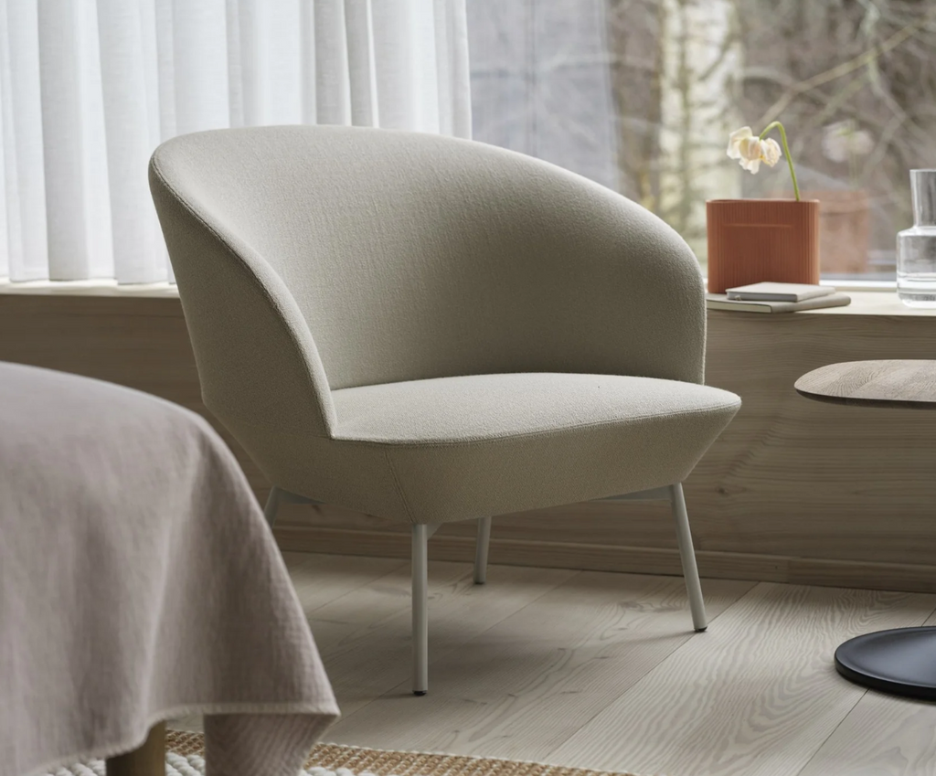 beige oslo lounge chair in bedroom with modern decor