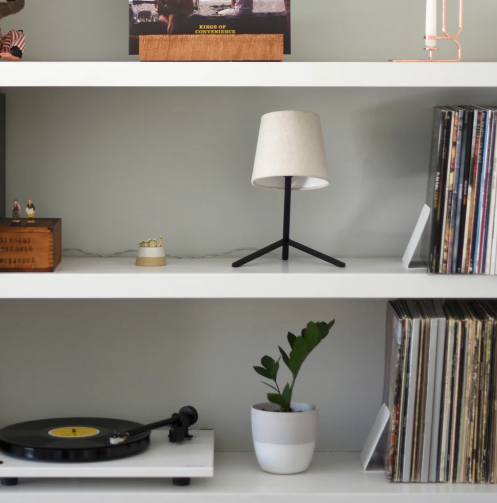 tokyo desk lamp with shade on shelf with albums and record player