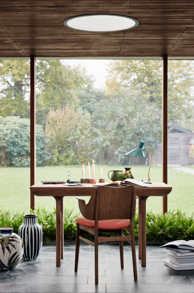 Runa office desk with lounge chair and backyard view