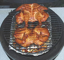 large-big-green-egg-smoking-2-spatchcock-chickens-rig.jpg__PID:194ab894-e2c9-458f-8895-3c097f4d6301