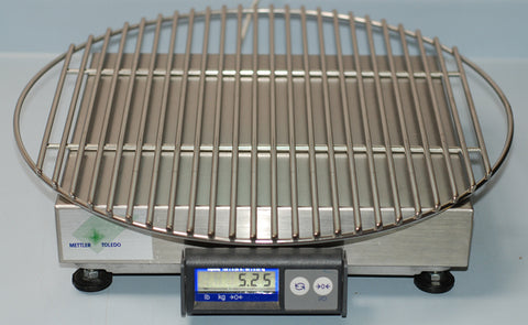 Ceramic Grill Store's, heavy duty, replacement Large Big Green EGG cooking grate sitting on the scale showing it weighs 5.65 lbs.