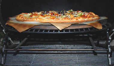 XL Big Green EGG Expander with XL Adjustable Rig baking a pizza atop the XL Rig inside an XL Big Green EGG.