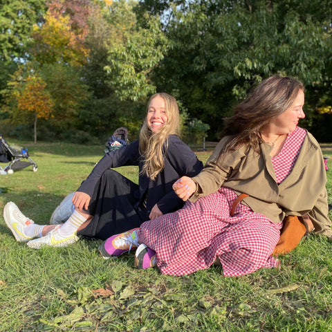 chaya and simi sitting in the park