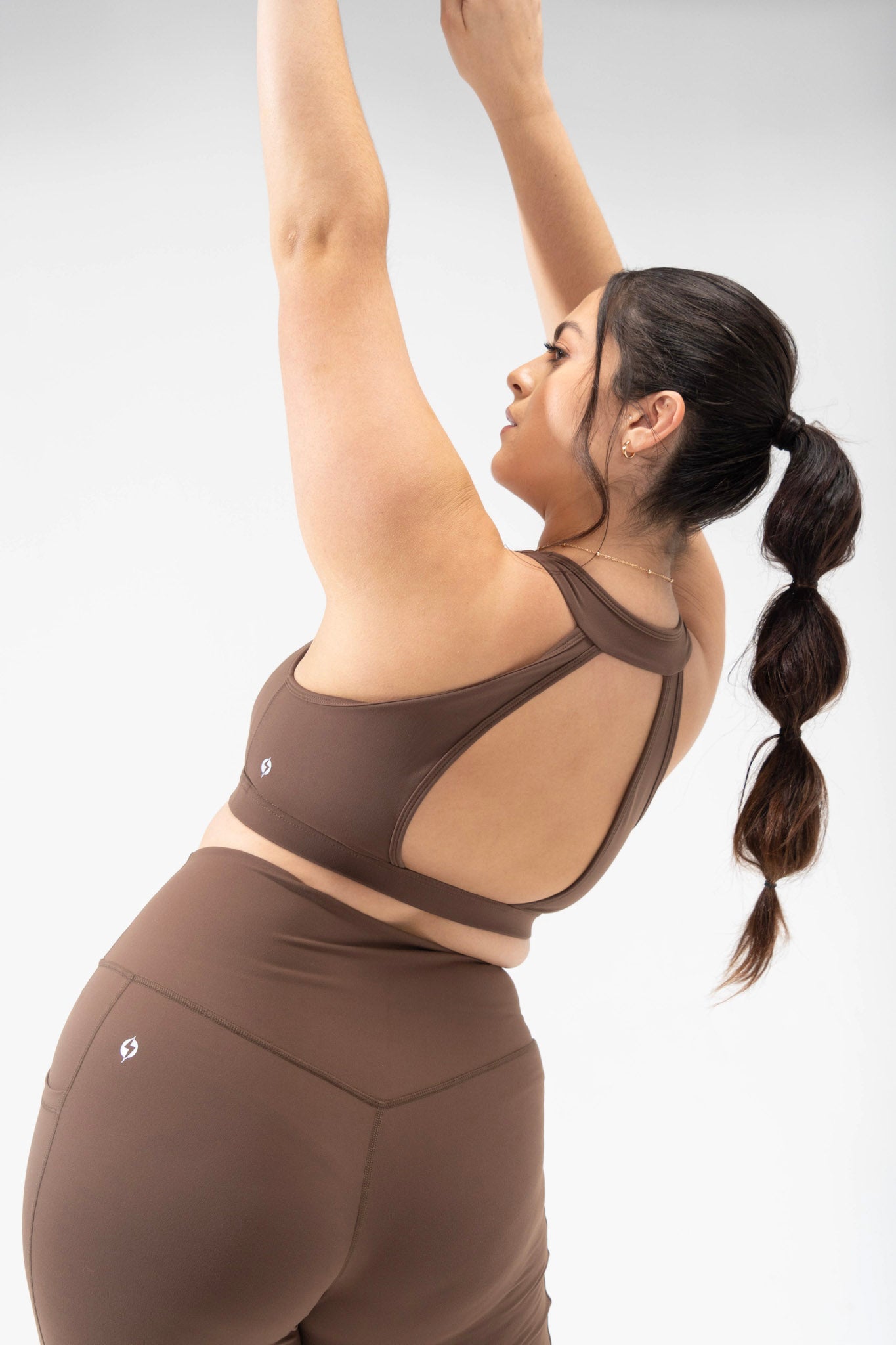 tan sport bra plus size model wears POPFLEX basics collection, captivate bra back detail