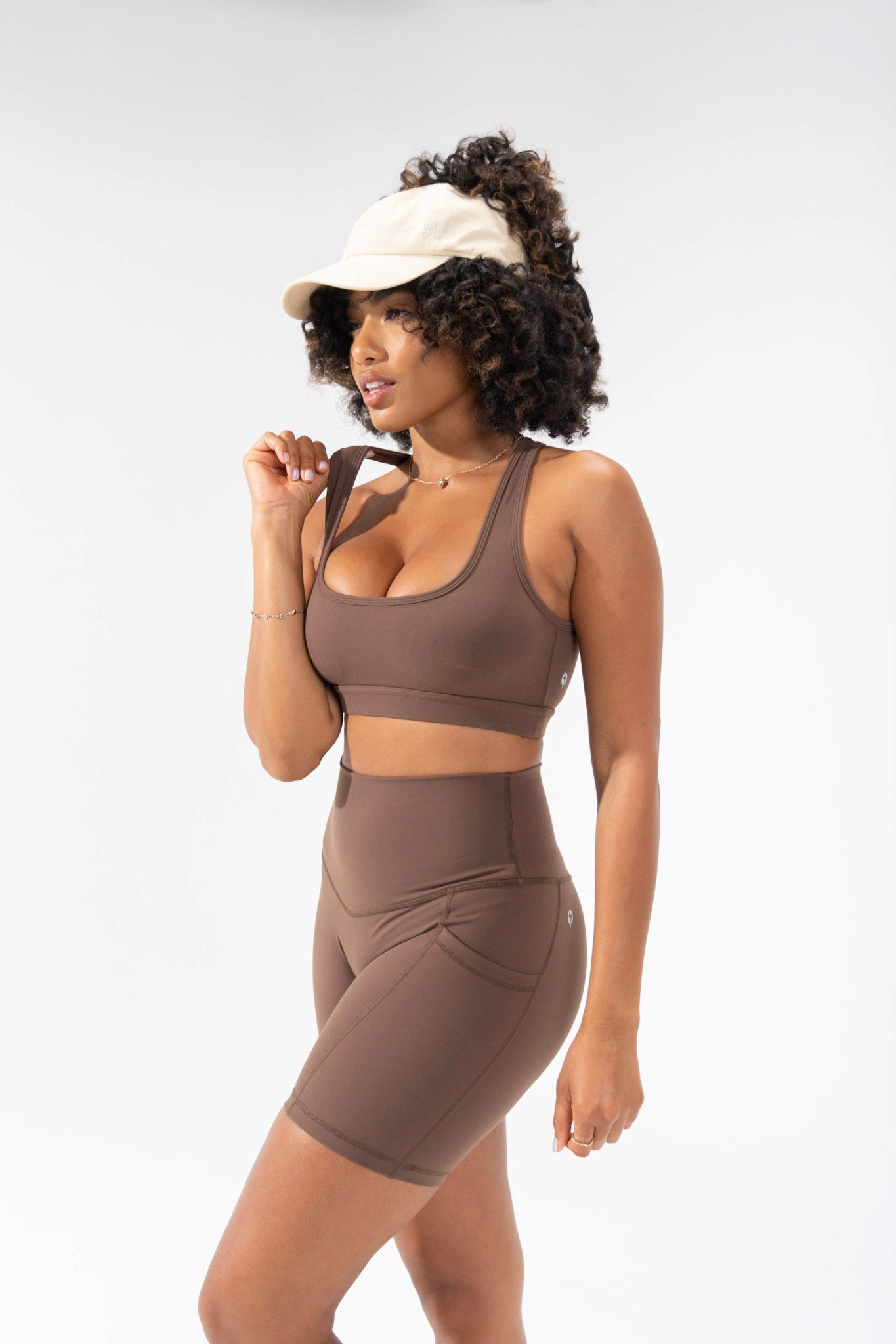 model wears neutral cute activewear, supersculpt short in mocha, POPFLEX basics collection biker short