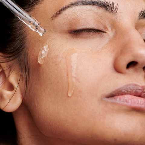 facial oil application on cheek