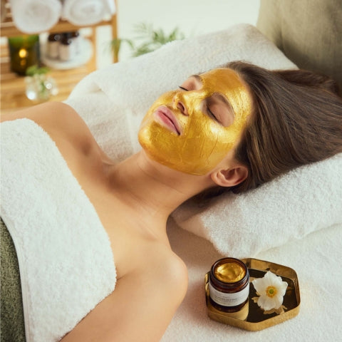 model wearing bio retinol gold face mask