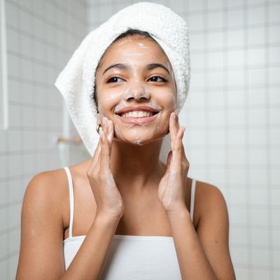 smiling girl double cleansing face
