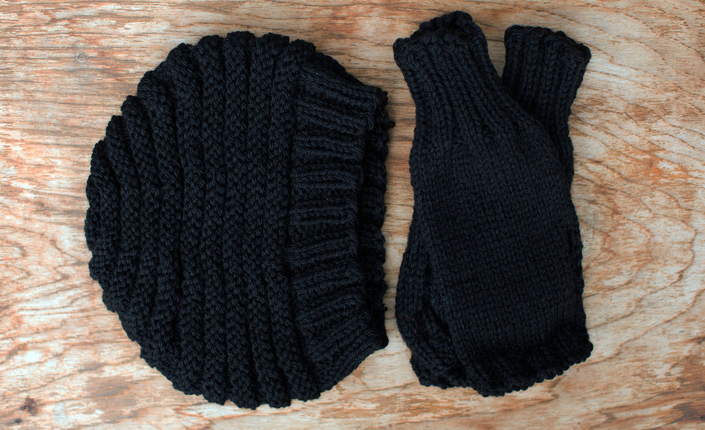 Matching Black knit cap and gloves. Handmade by the TOM BIHN Ravelry group for the TOM BIHN crew.