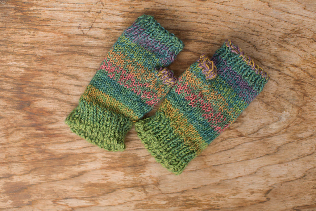 Multi-color green, blue, pink fingerless mittens. Handmade by the TOM BIHN Ravelry group for the TOM BIHN crew.