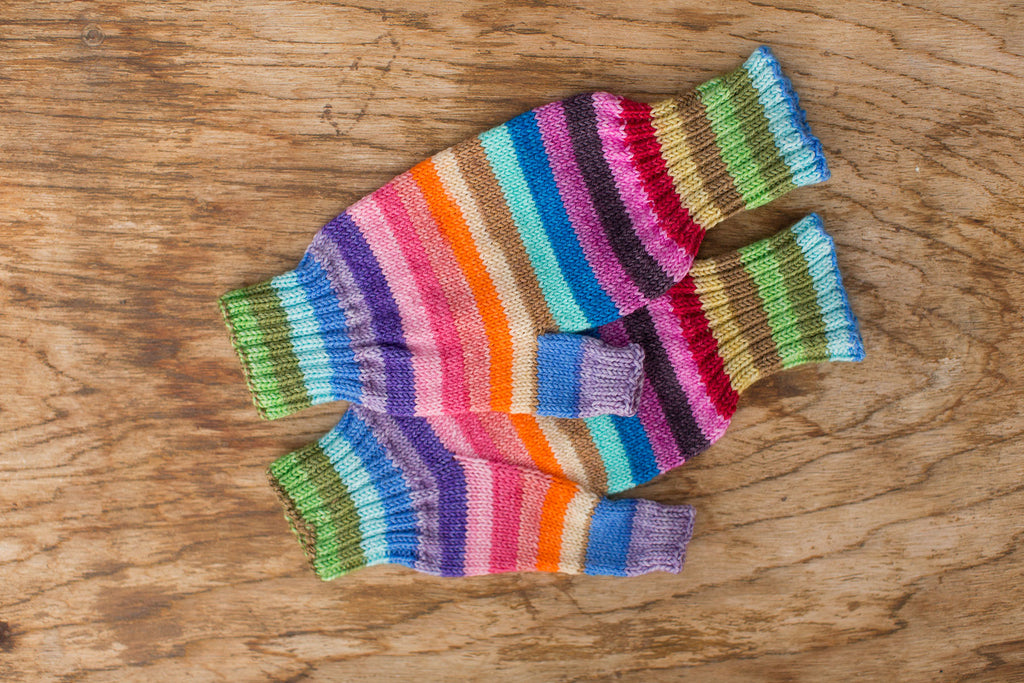 Rainbow fingerless gloves. Handmade by the TOM BIHN Ravelry group for the TOM BIHN crew.