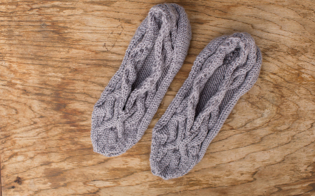 Grey slipper socks. Handmade by the TOM BIHN Ravelry group for the TOM BIHN crew.