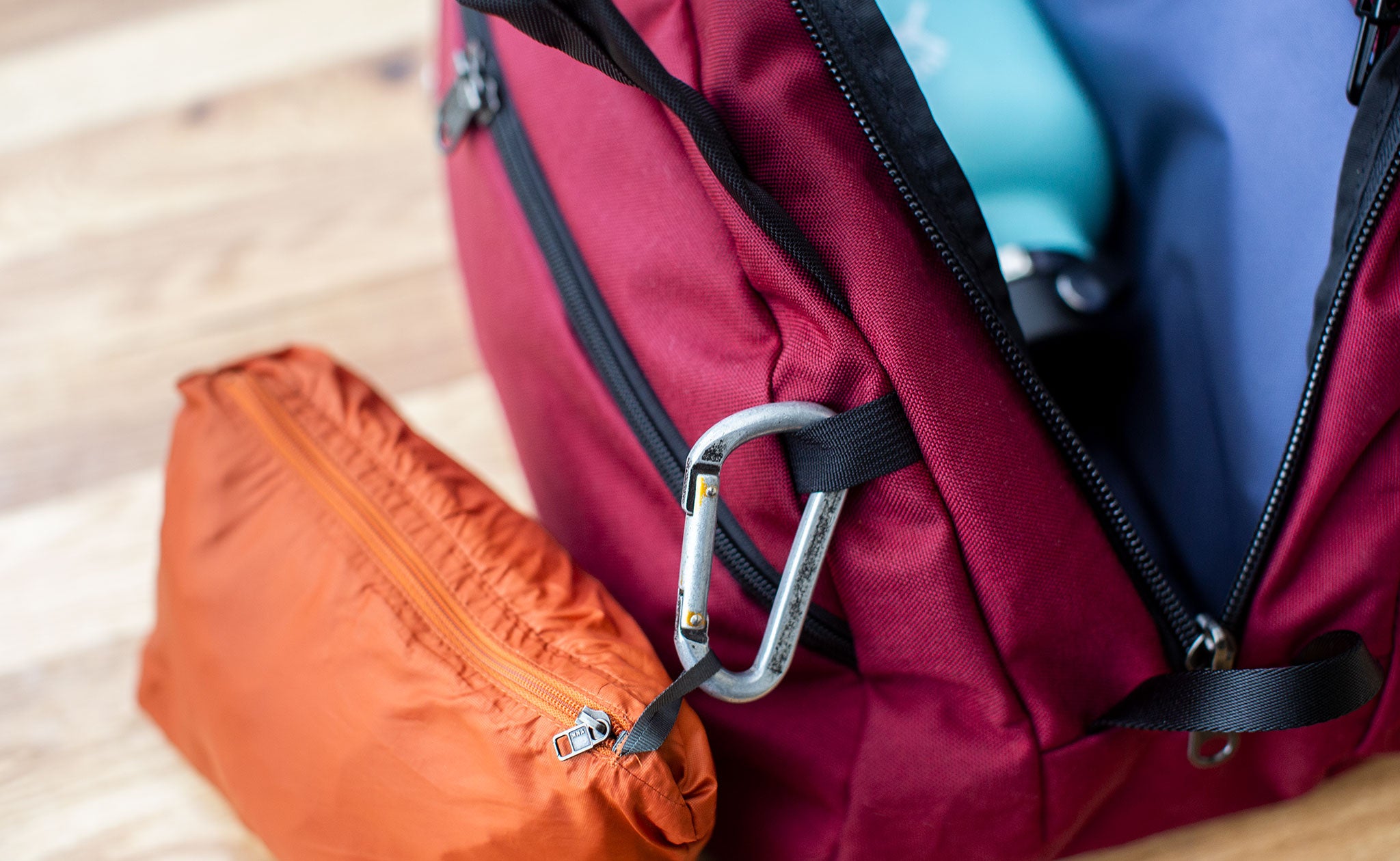 Close-up of a carabiner attached to the webbing tab on an OSCA.