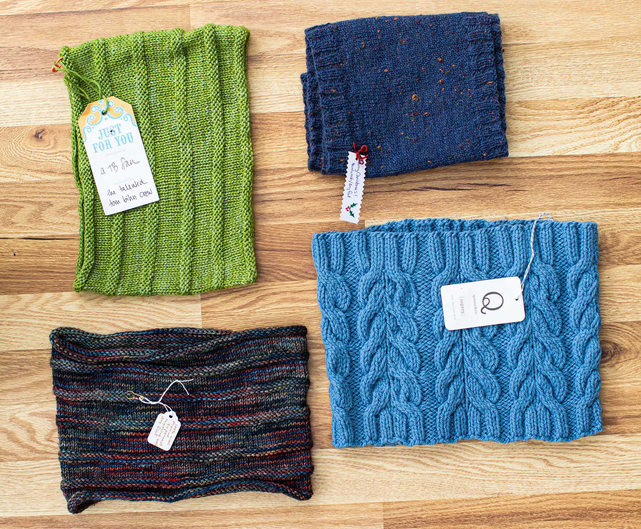 Four cowls! Each an interesting shade of dark blue, medium blue, multi-color and green.