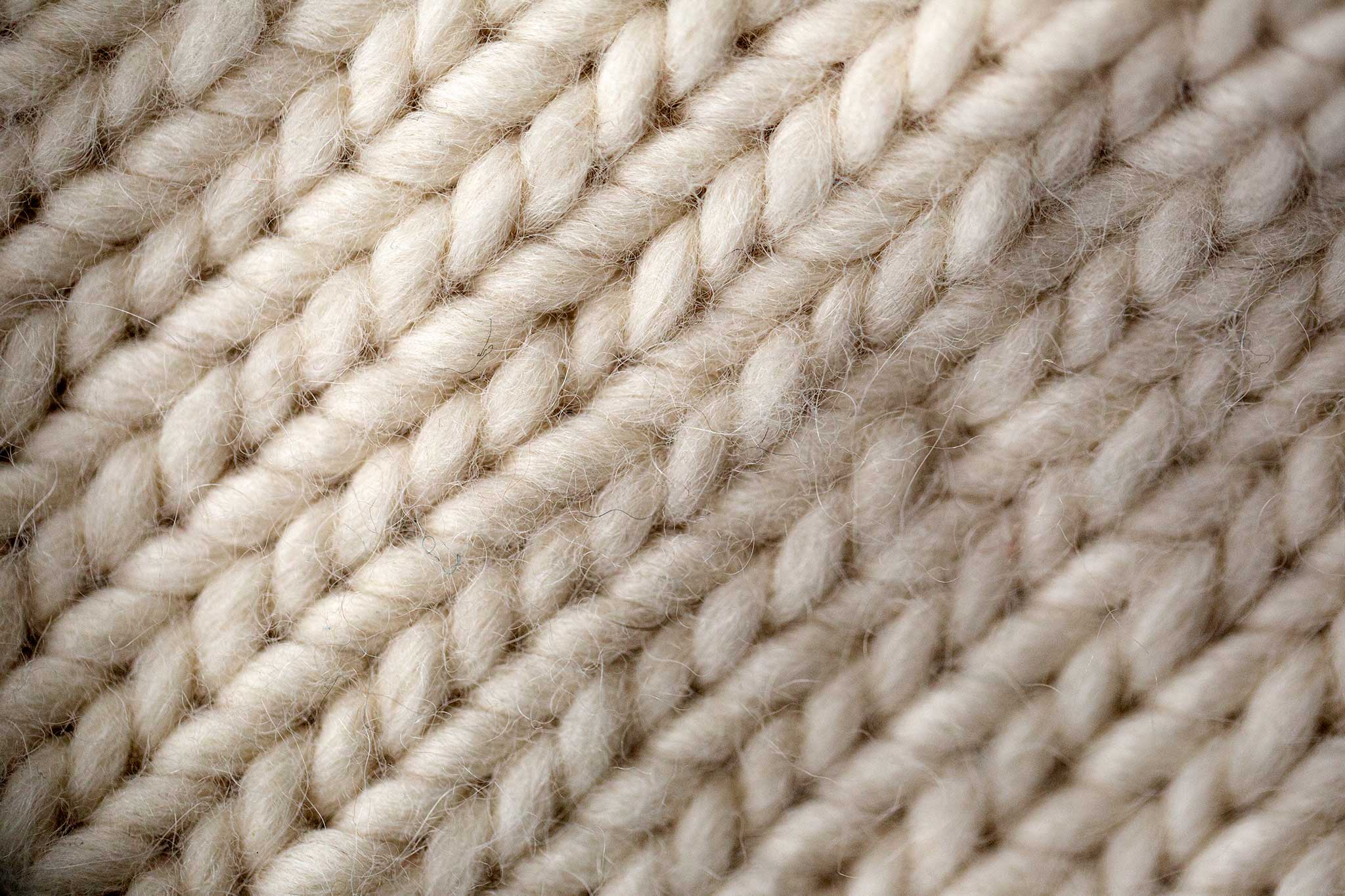 Close-up of a beautiful white knitted scarf.