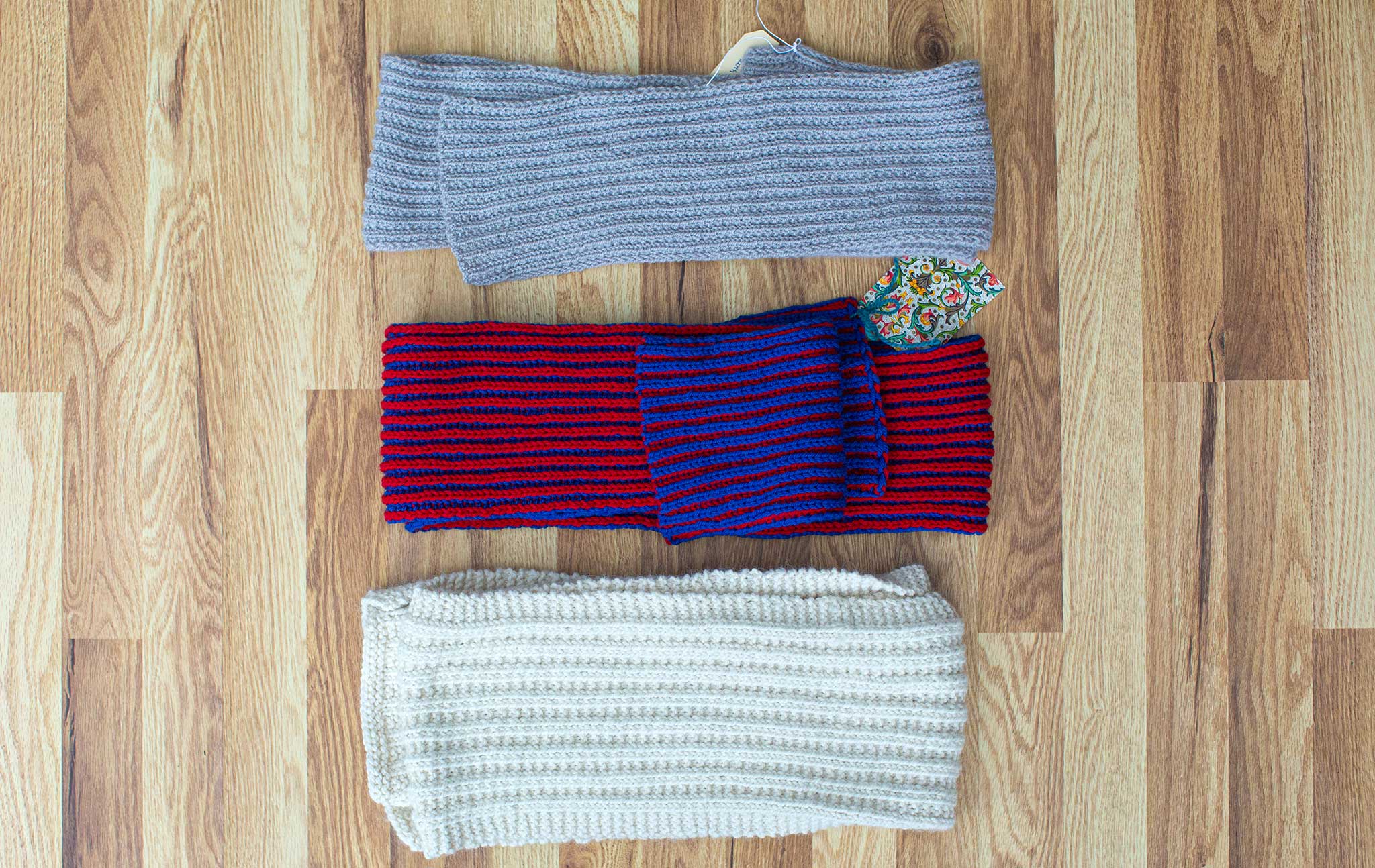 Three scarves ~ grey on top, blue/red in the middle, and white at the bottom.