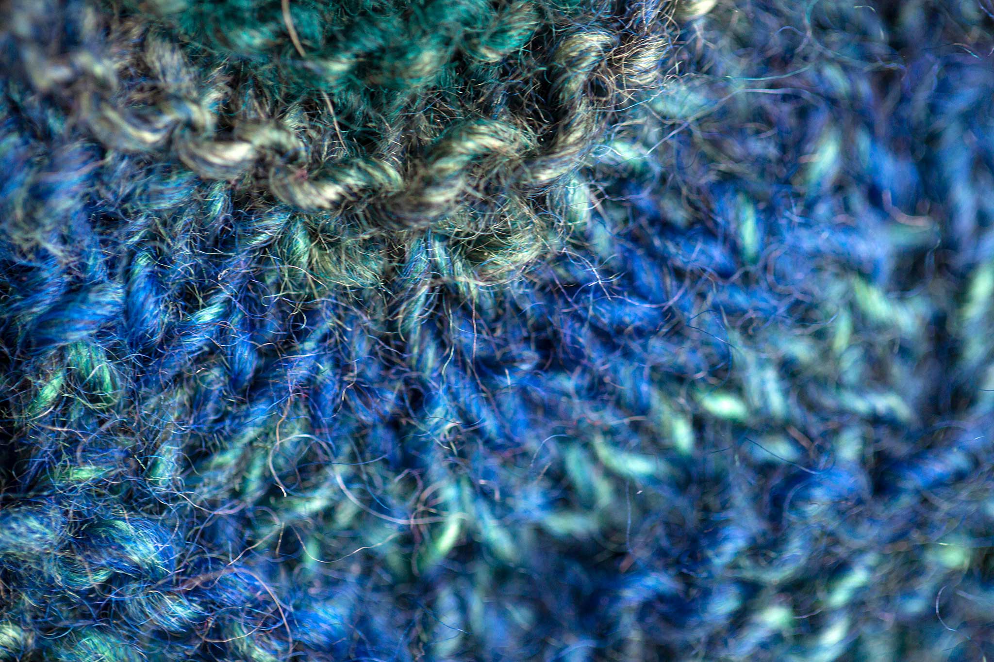 Close-up of a beautiful crafted item in shades of blue and green.