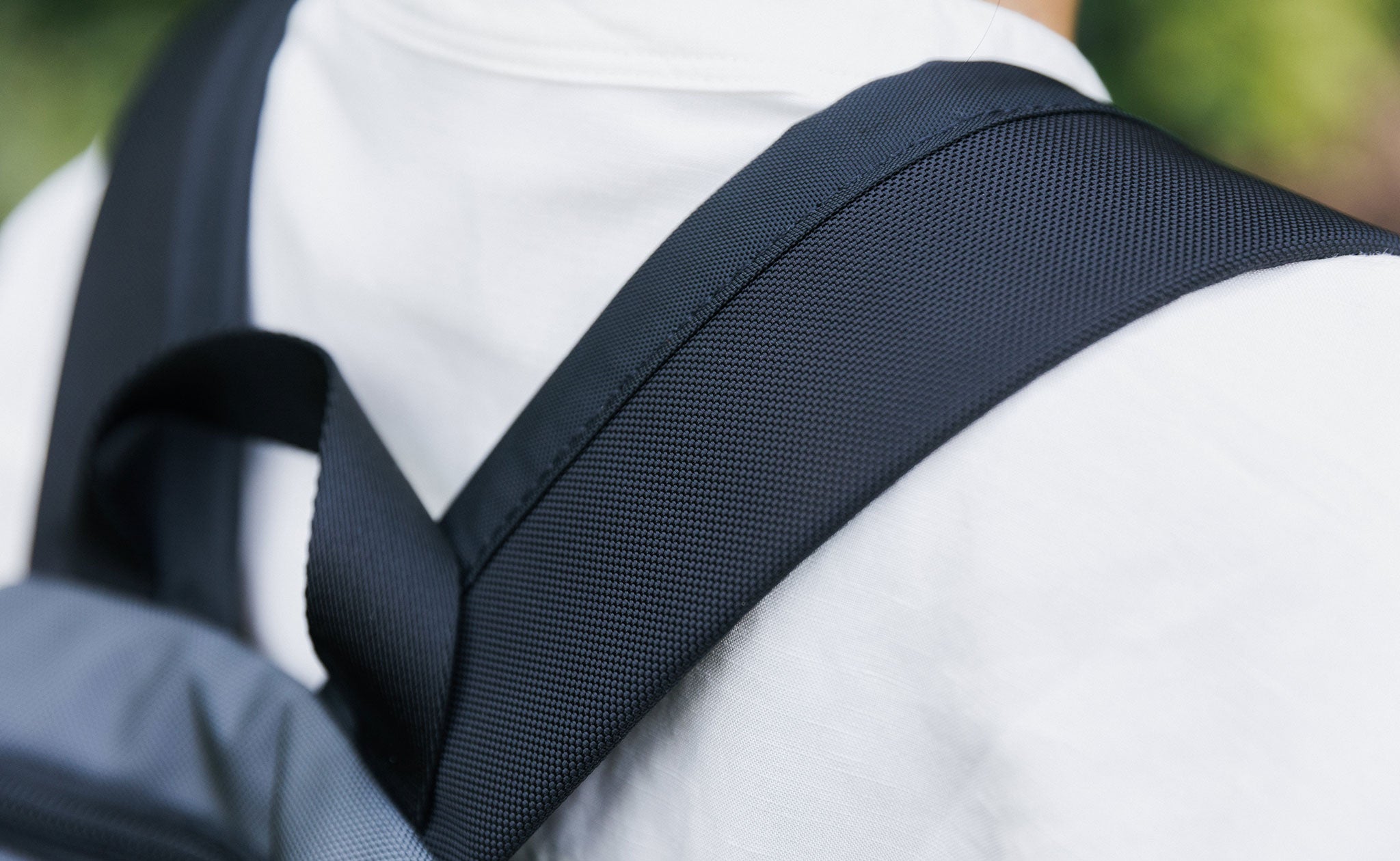 The Contour Backpack Straps of the Paradigm on a person's shoulders