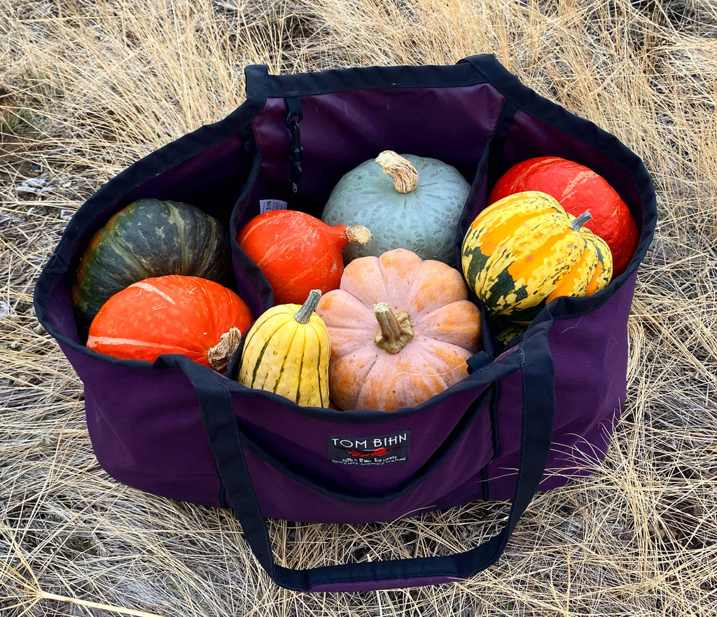 A Monster Truck tote bag in Aubergine filled with 35lbs of winter squash.
