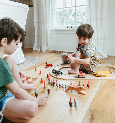 Children playing with a train set