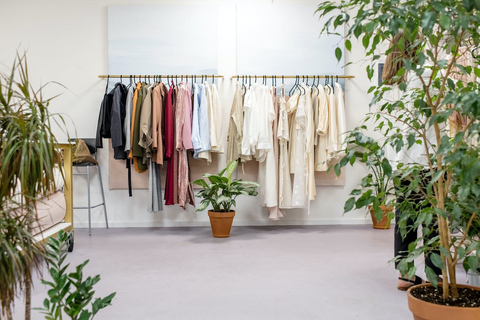 Several clothing items in a consignment boutique corner