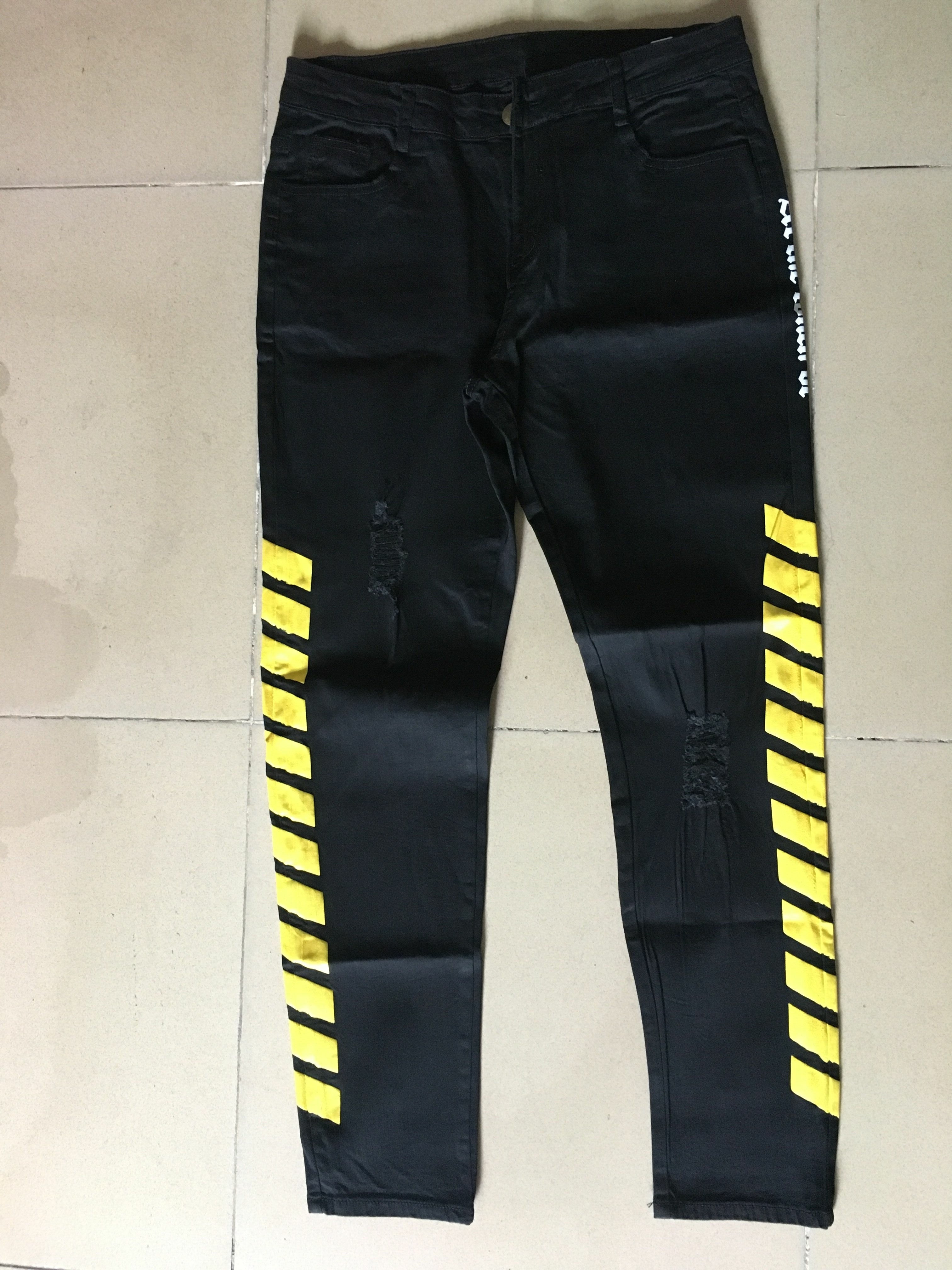 black jeans with yellow stripe