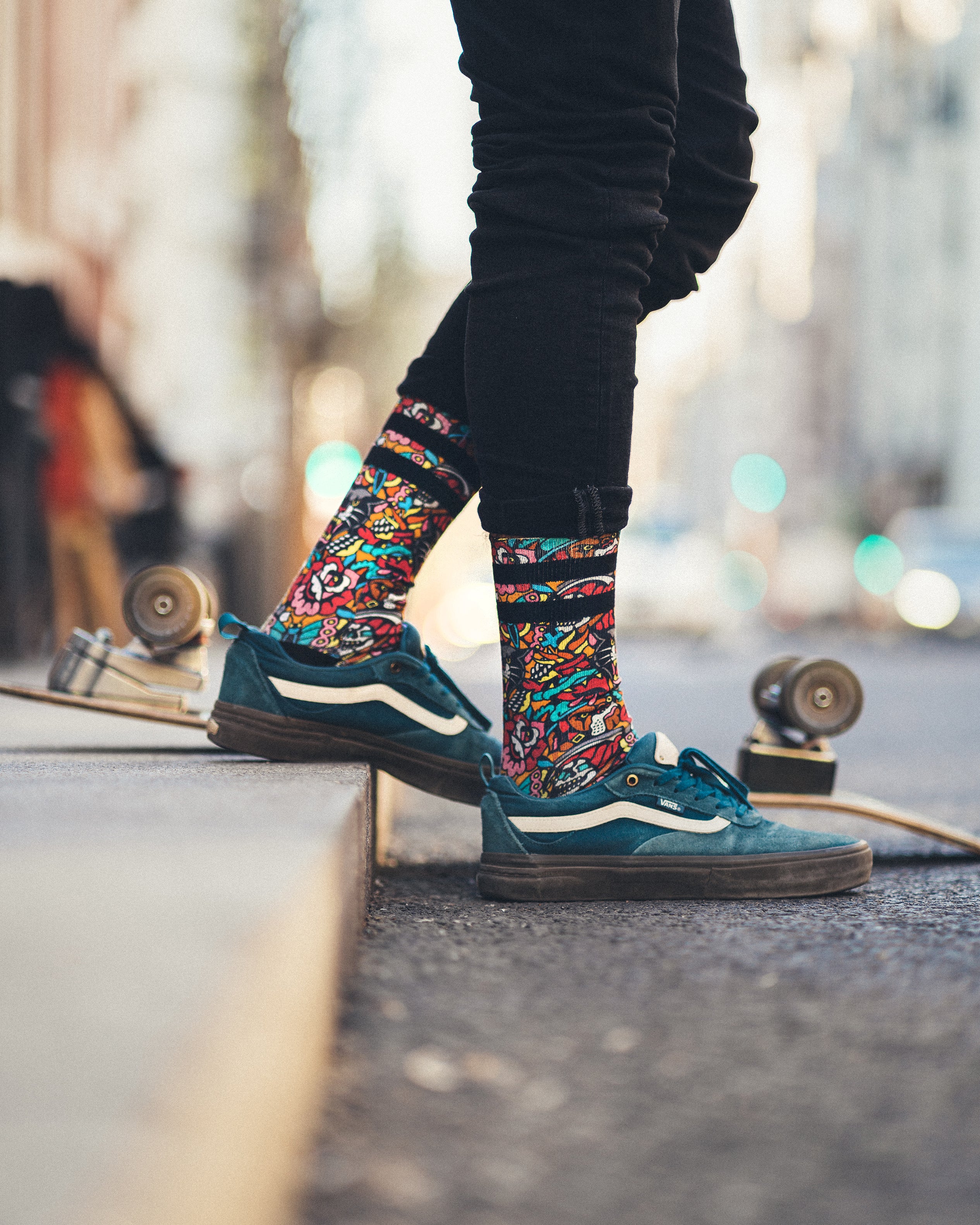 Bulldog socks with skateboard in the background 