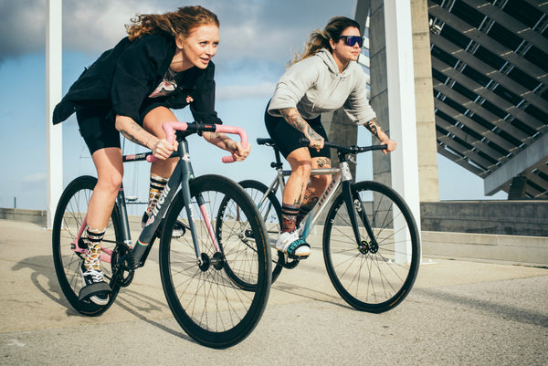 two girls riding bikes 