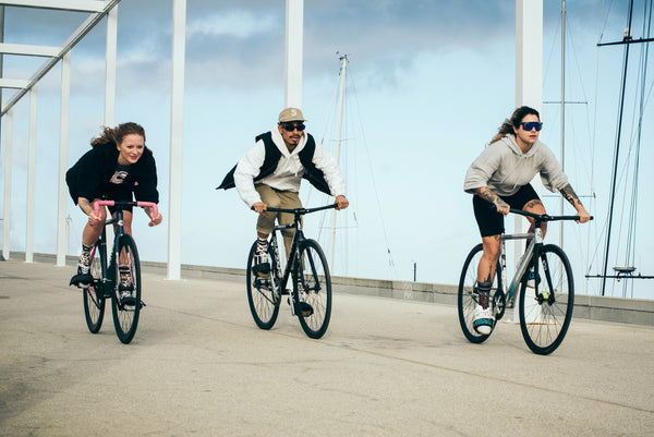 two girls and one guy riding their bikes