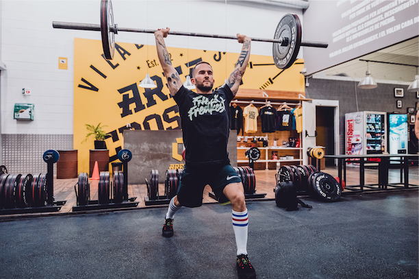 guy deadlifting in a CrossFit gym wearing American Socks 