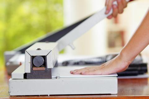 a person standing in front of a laptop